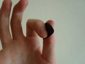 Holding the guitar plectrum