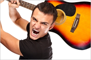 angry guitarist ready to smash his guitar