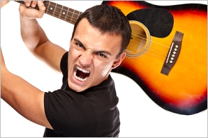 angry guitarist ready to smash his guitar angry guitarist ready to smash his guitar