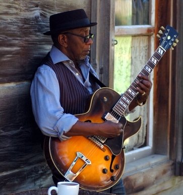 guitarist playing blues chord progressions